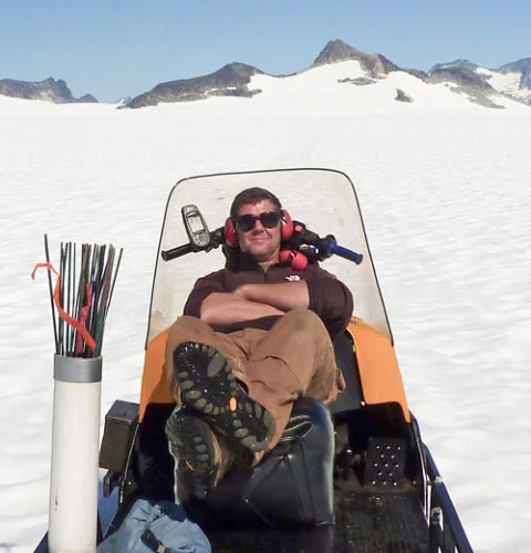 Scott on his trusty steed, Thor the snow machine.