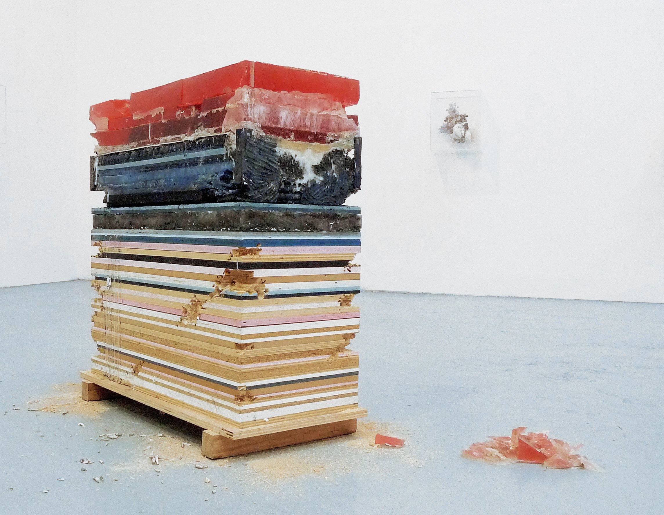  large scale plywood wax and concrete sculpture full of colors in a contemporary art gallery in new york 