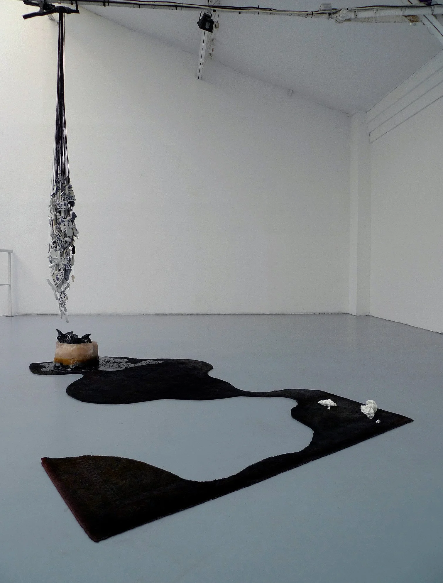  large scale plywood wax and concrete sculpture full of colors in a contemporary art gallery in new york 