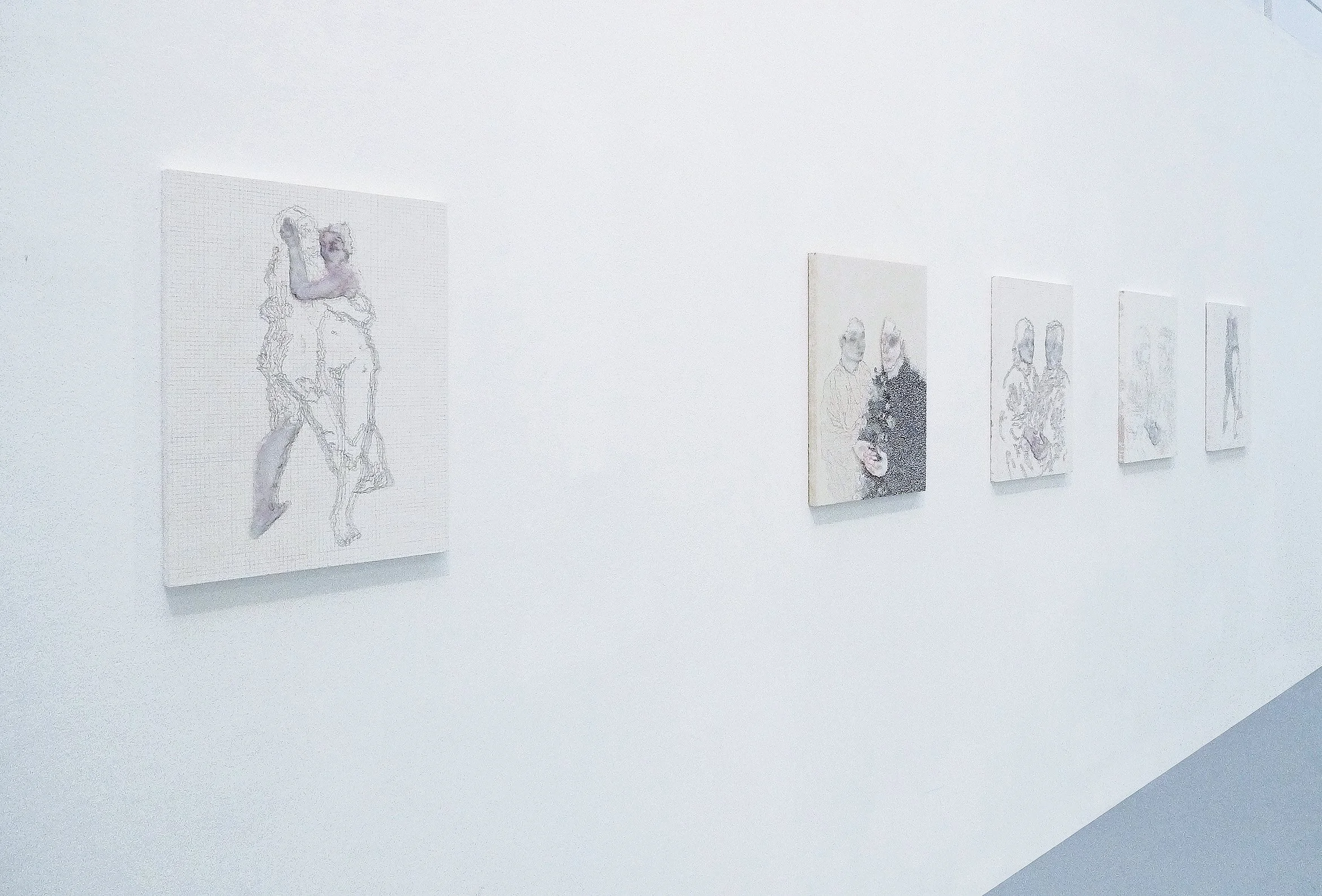  gallery exhibition walls in new york showing drawings on wood panels, a series of detailed sketches depicting couples hugging 