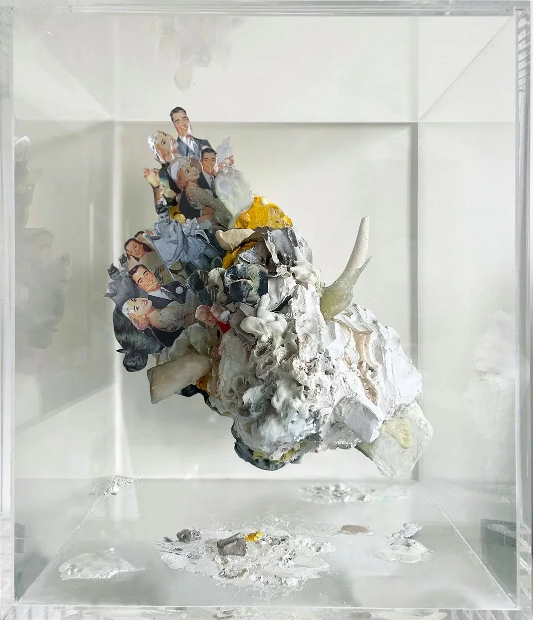 Large scale concrete colored sculpture made with colored plaster and objects, pin up photos in a large plexiglas box exhibited in a new york contemporary art gallery