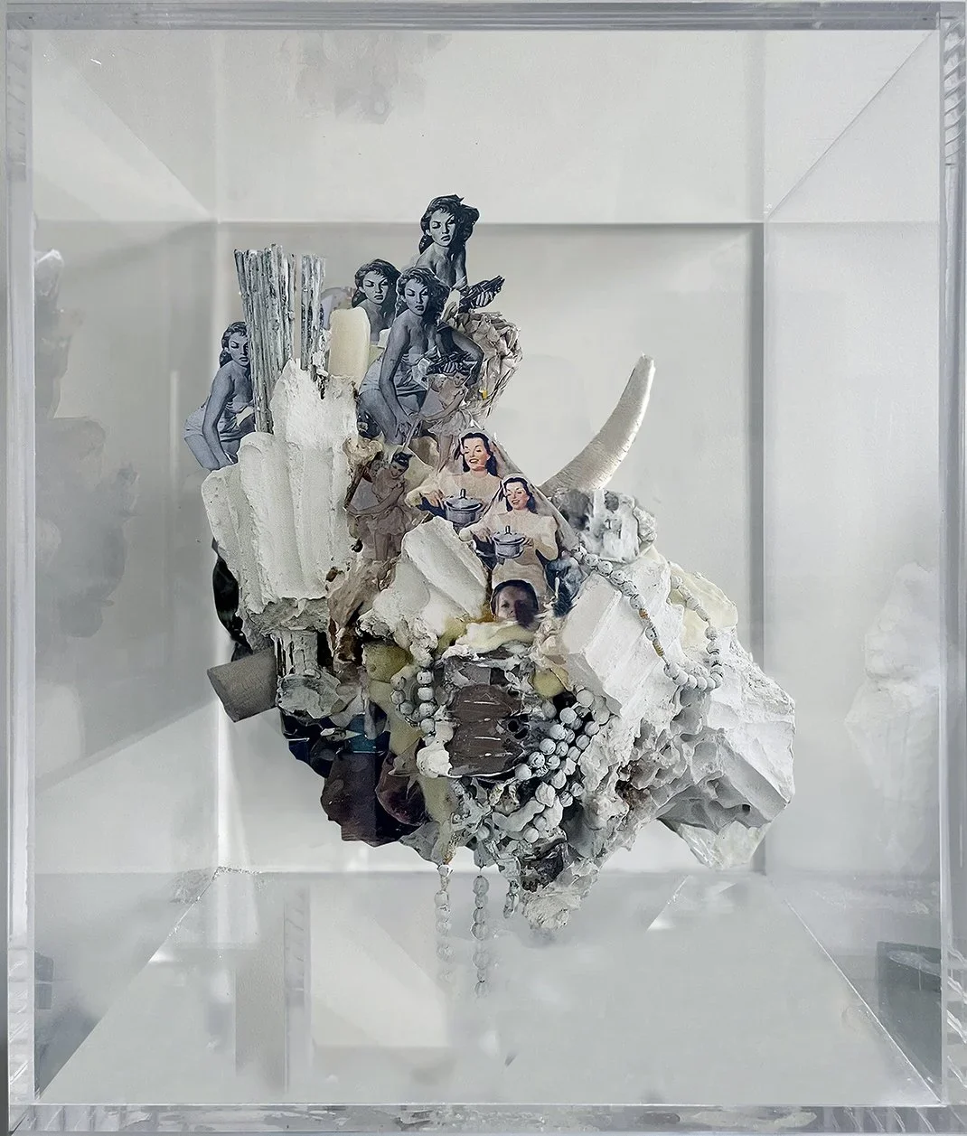 Large scale concrete colored sculpture made with colored plaster and objects, pin up photos in a large plexiglas box exhibited in a new york contemporary art gallery