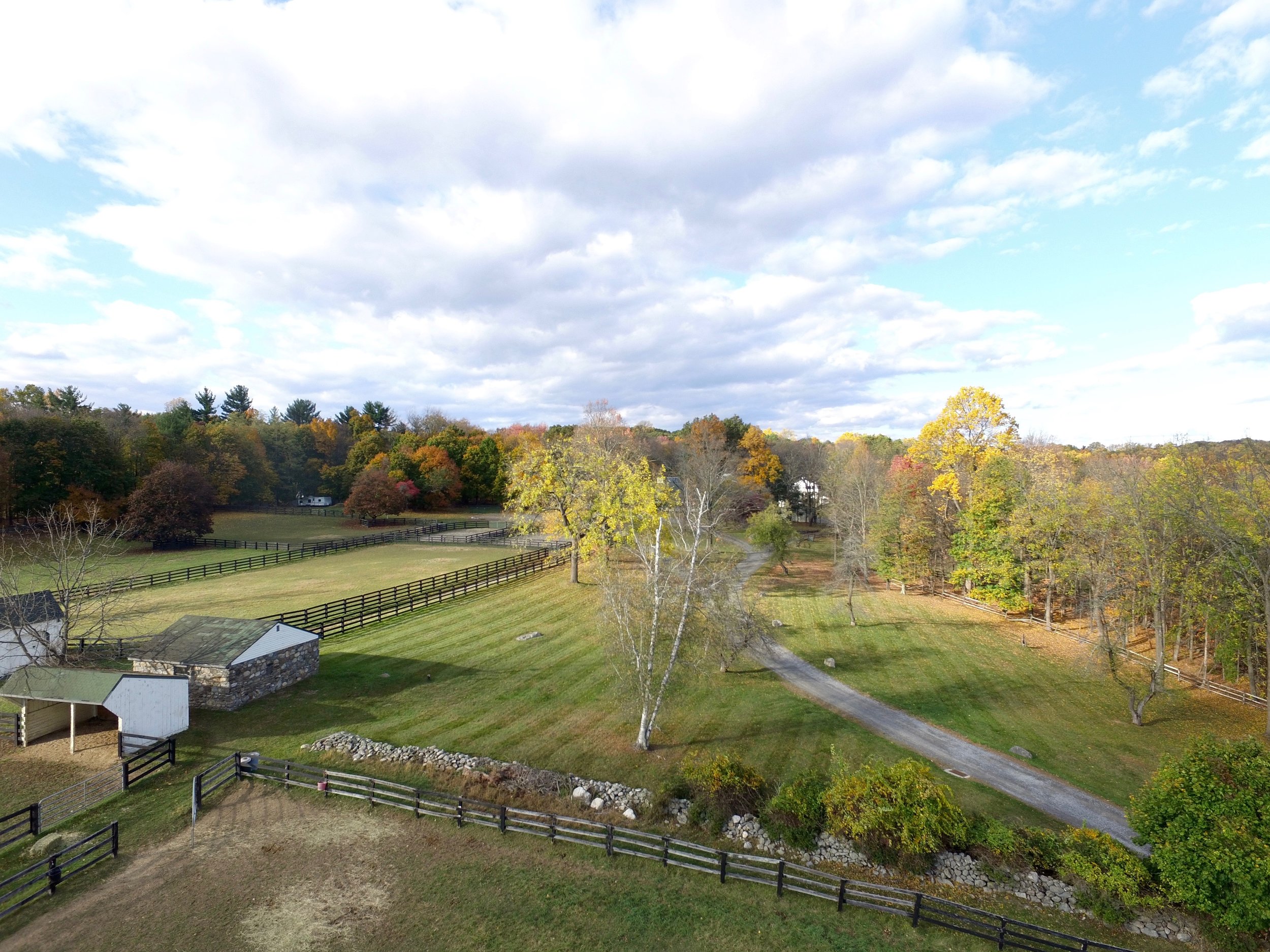 Drone picture of south end of farm including pastures and old stone building