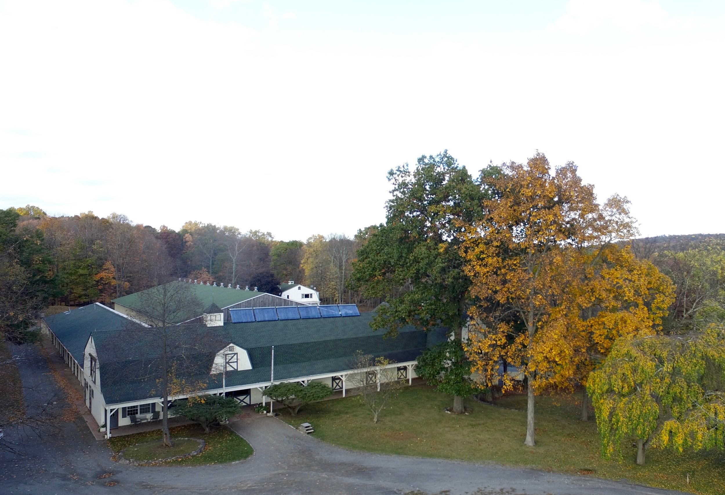 drone view of barn and indoor ring