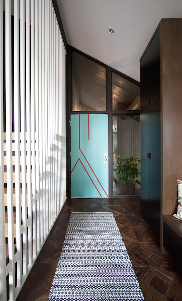 modern entryway with bright front door
