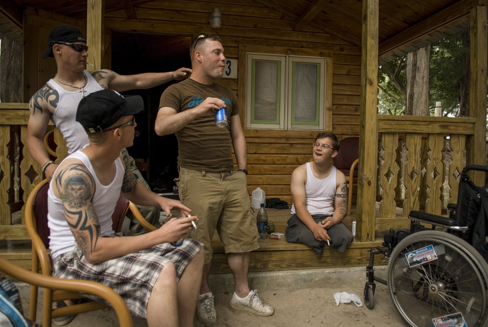 Shooting the breeze outside their cabin at Okuma March 28, the Marines indulged in an old routine, cracking jokes and razzing each other endlessly. 