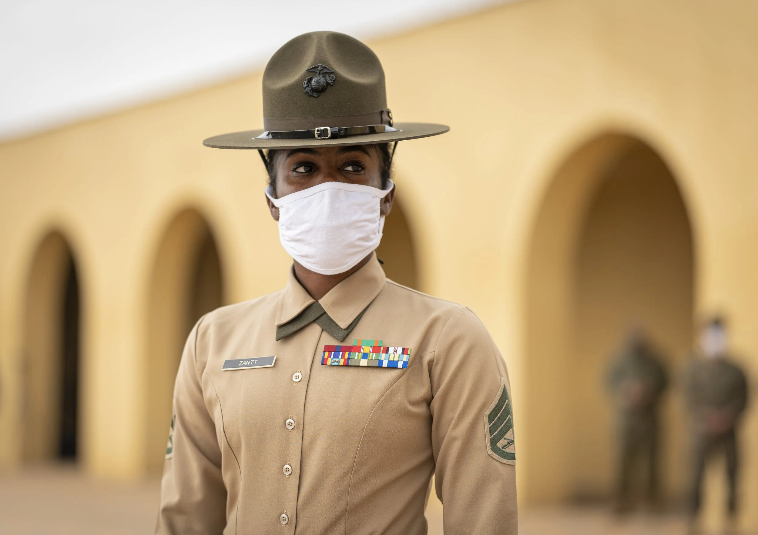 Staff Sgt. Ayesha Zantt, a drill instructor at Marine Corps Recruit Depot San Diego waits to receive busloads of recruits in front of the iconic yellow footprints outside the receiving barracks at the depot Feb. 9. Photo by Ethan E. Rocke/Coffee or 