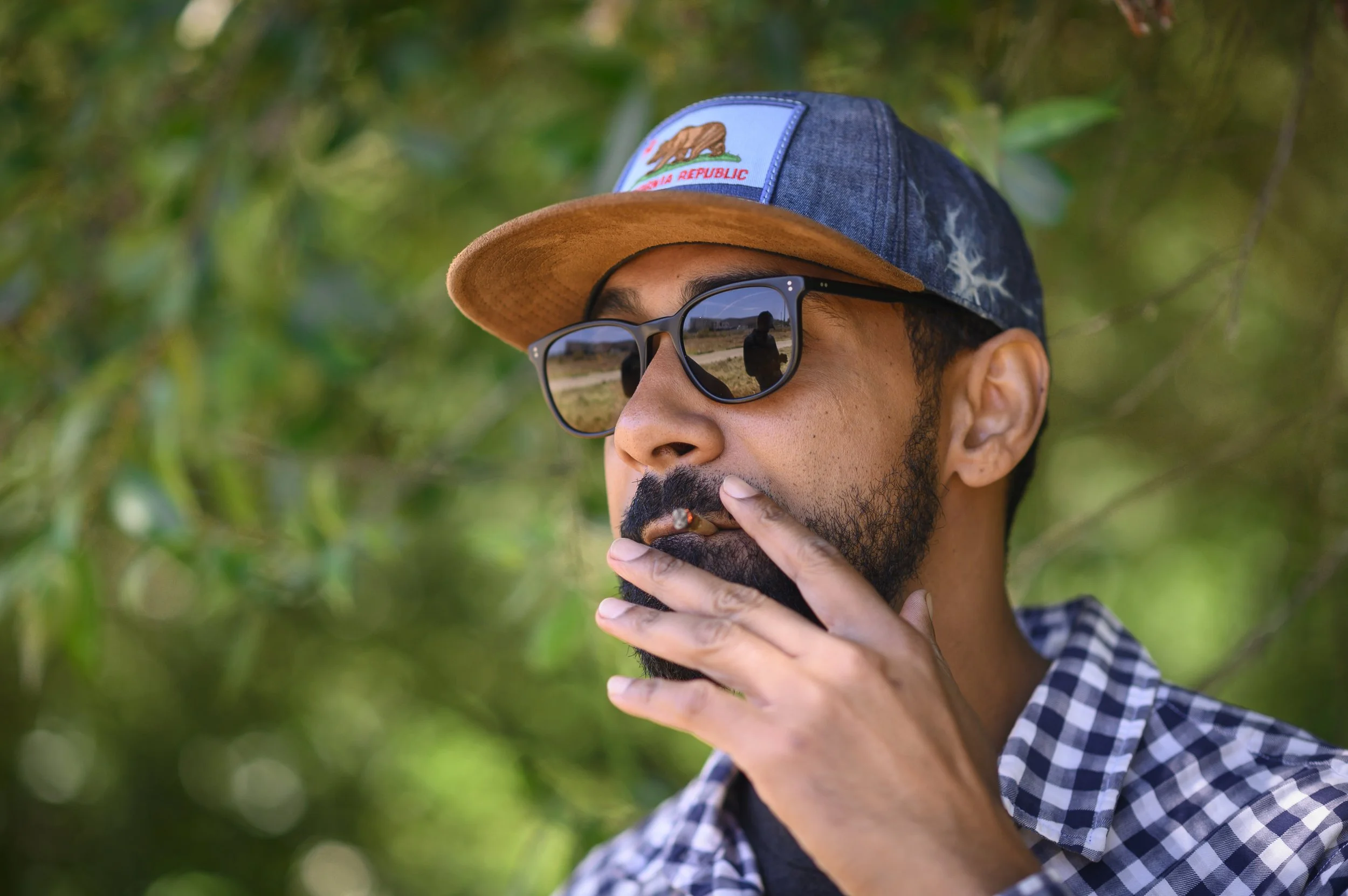  Santa Cruz Veterans Alliance Chief Compliance Officer Seth Smith smokes a joint. After leaving the Navy, Smith, who served as a linguist, completed a master's from Princeton University. He joined SCVA in January 2017. Photo courtesy of Ethan E. Rock