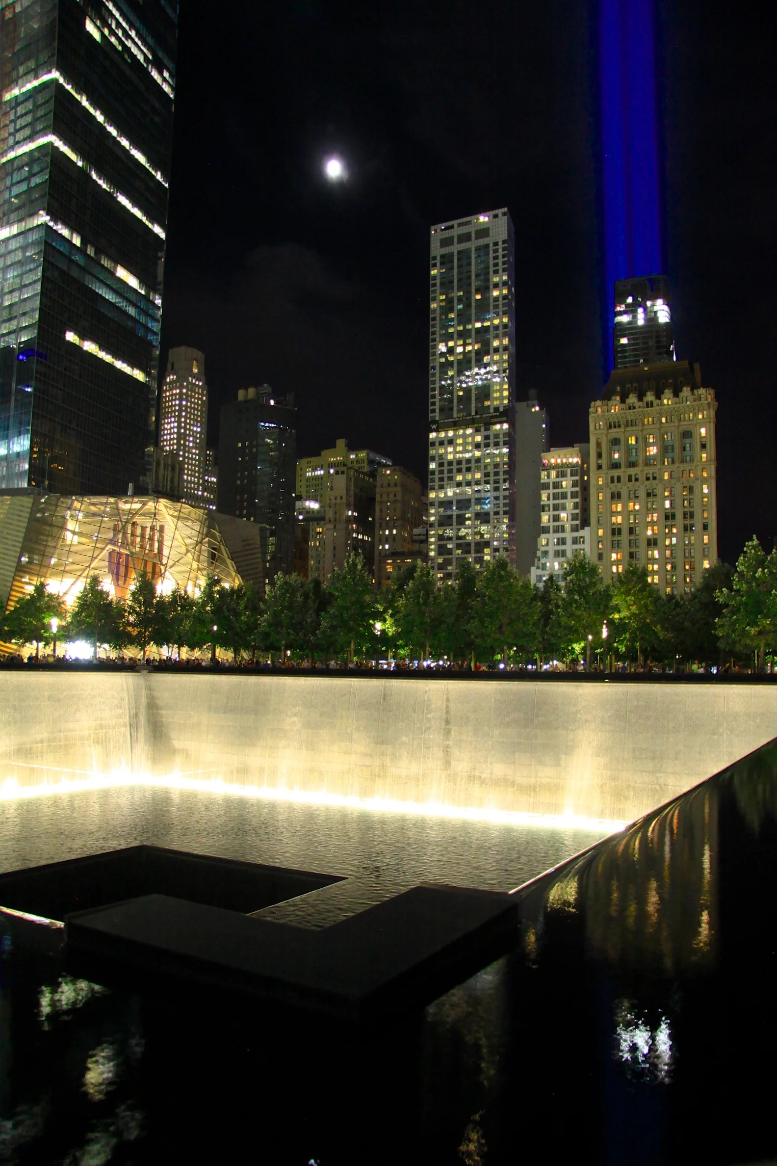 The 9/11 Memorial with the tribute lights beaming skyward. © Bobby Magill