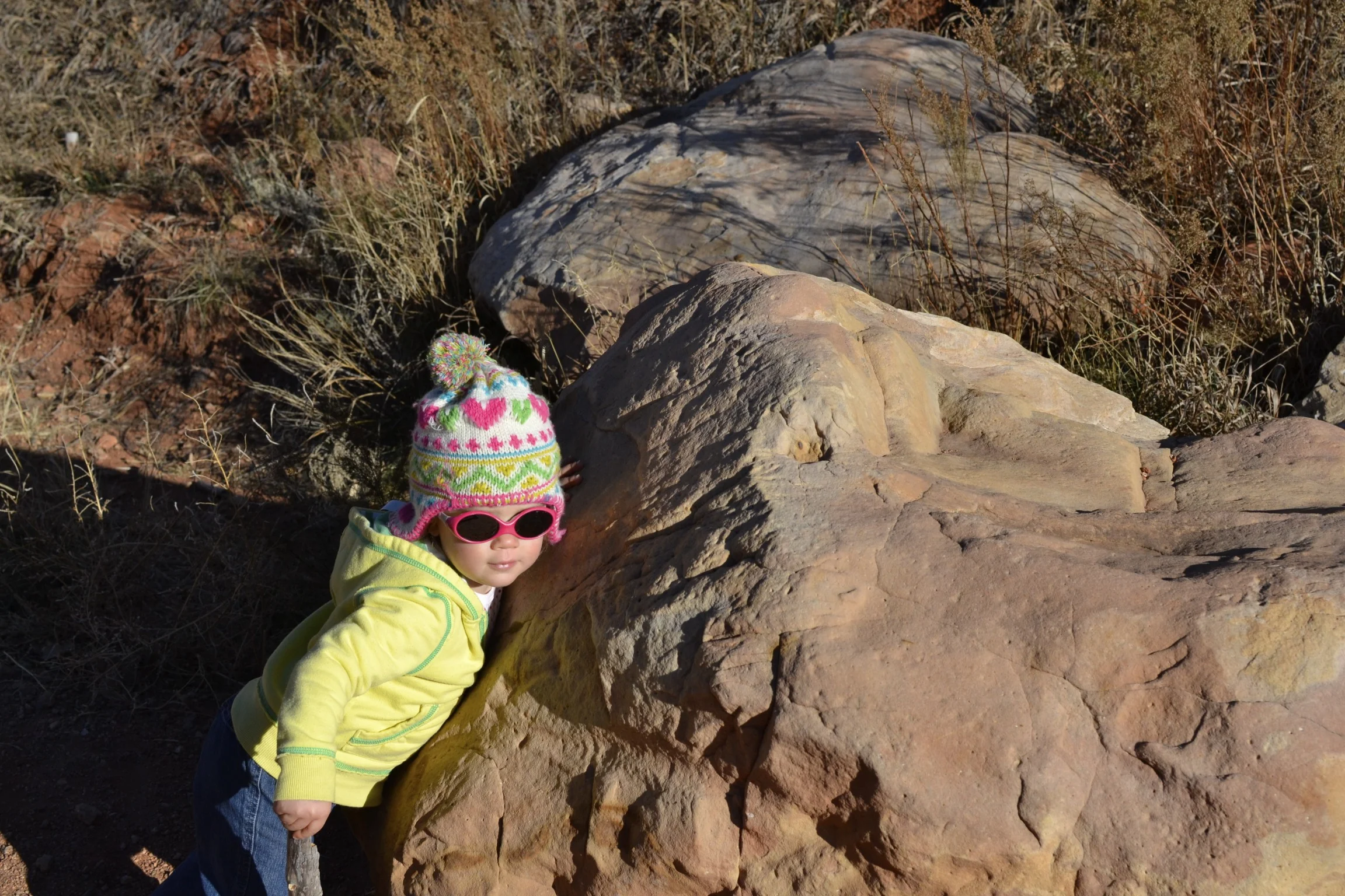she loves giving hugs...even to rocks.