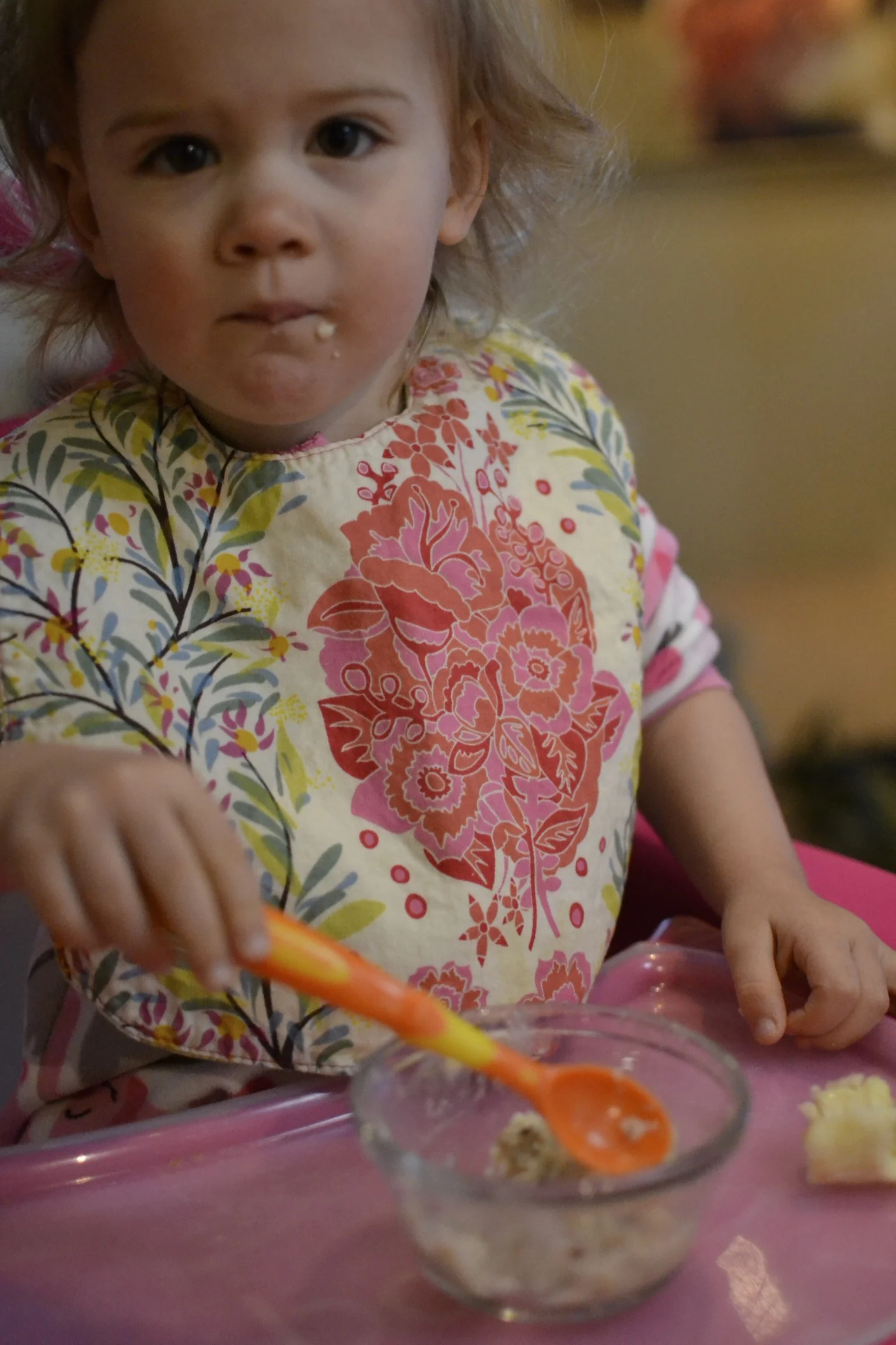 breakfast of "mush" (oatmeal but, thanks to the book 'goodnight moon', all oatmeal is now "mush). she's getting so good at using her spoon! 