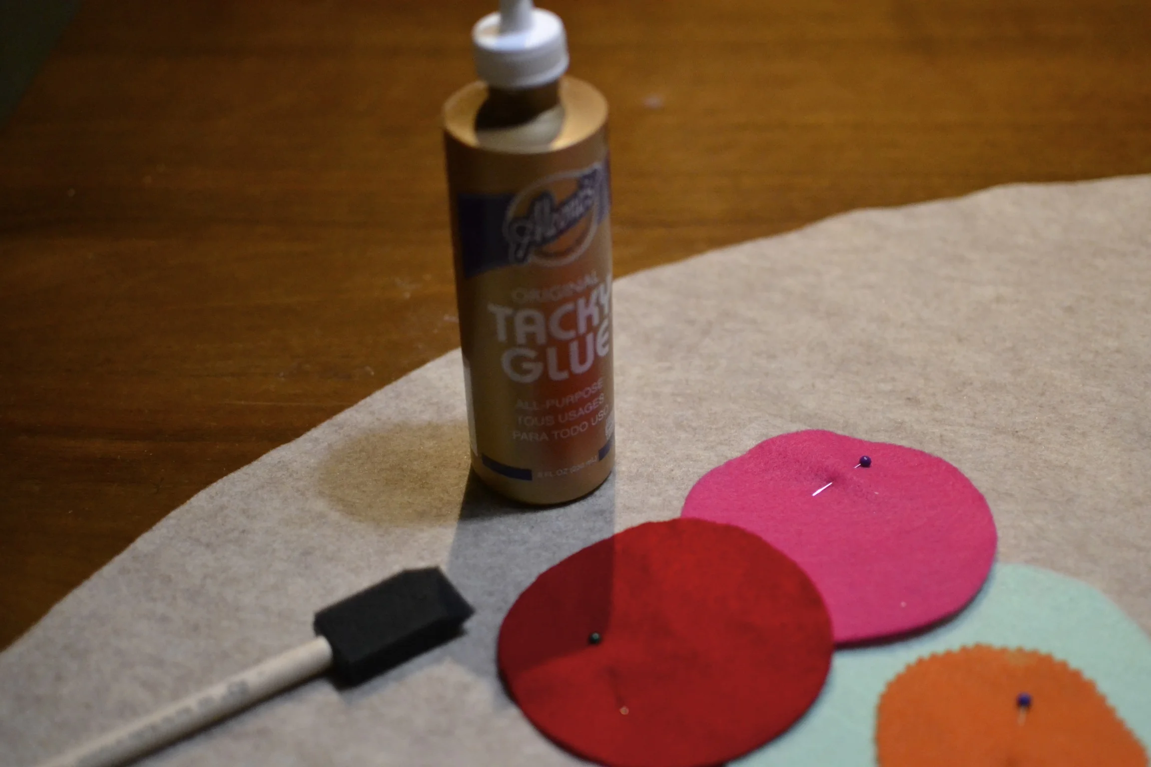 using a foam brush, i lightly applied glue to the edges of my circles and laid them down in place. 