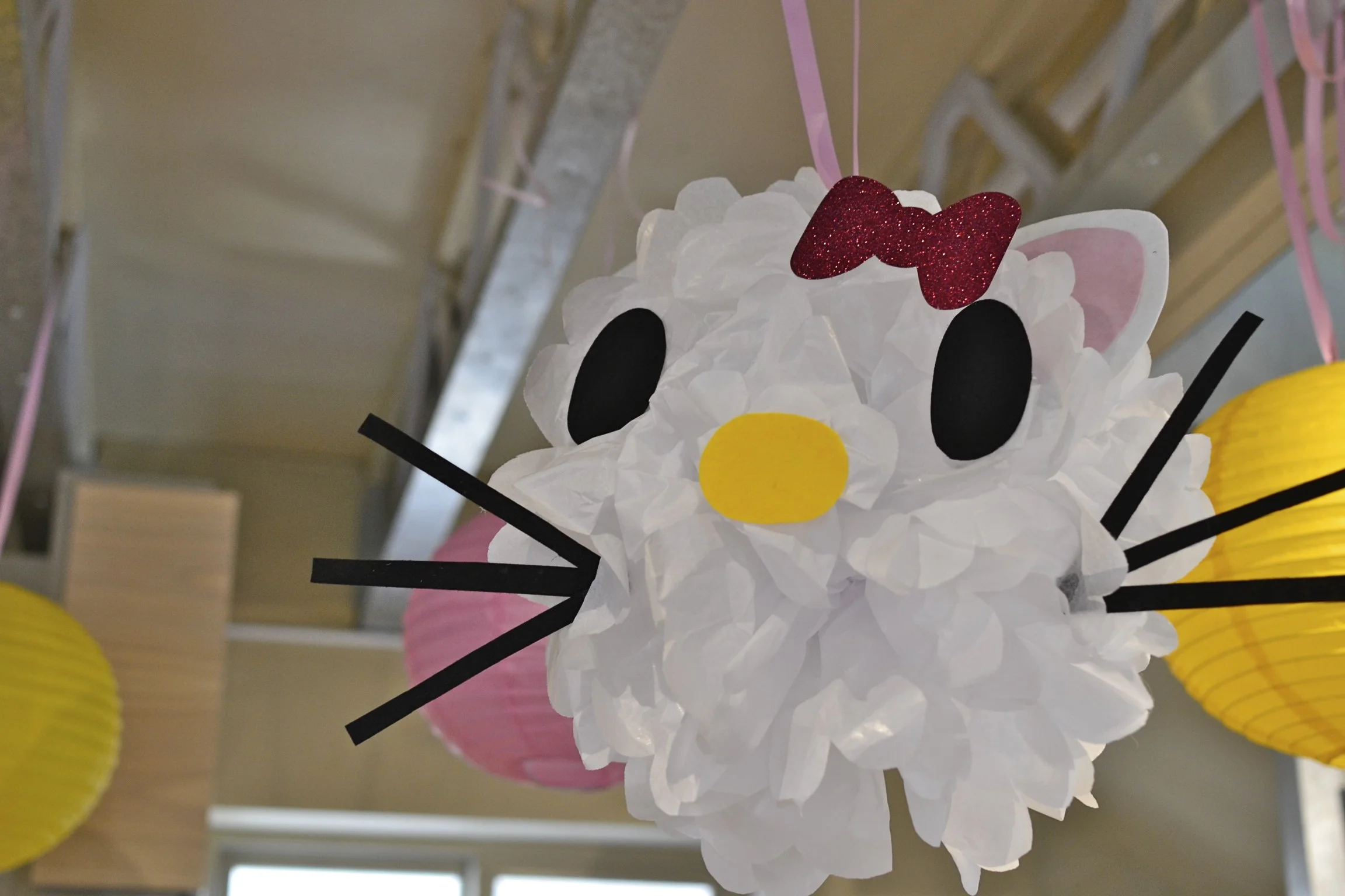 i had so much fun making these hello kitty tissue paper pompoms. i got the idea from my friend sarah...you can check out the instructions here . the eyes on my kitties are a little large but overall, i was pretty excited about how they turned out! 
