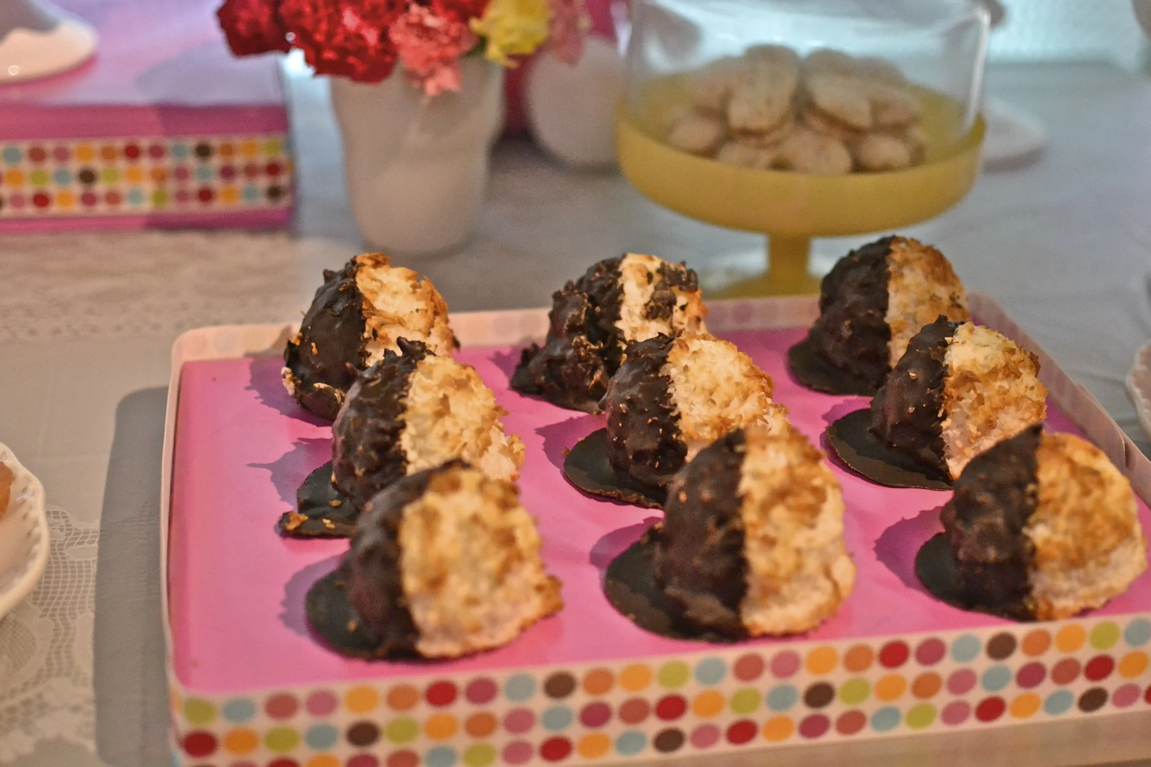 these are truly the most scrumptious, gargantuan coconut macaroons ever. so good and dipped in dark chocolate. purchased from a local favorite - rico's . 