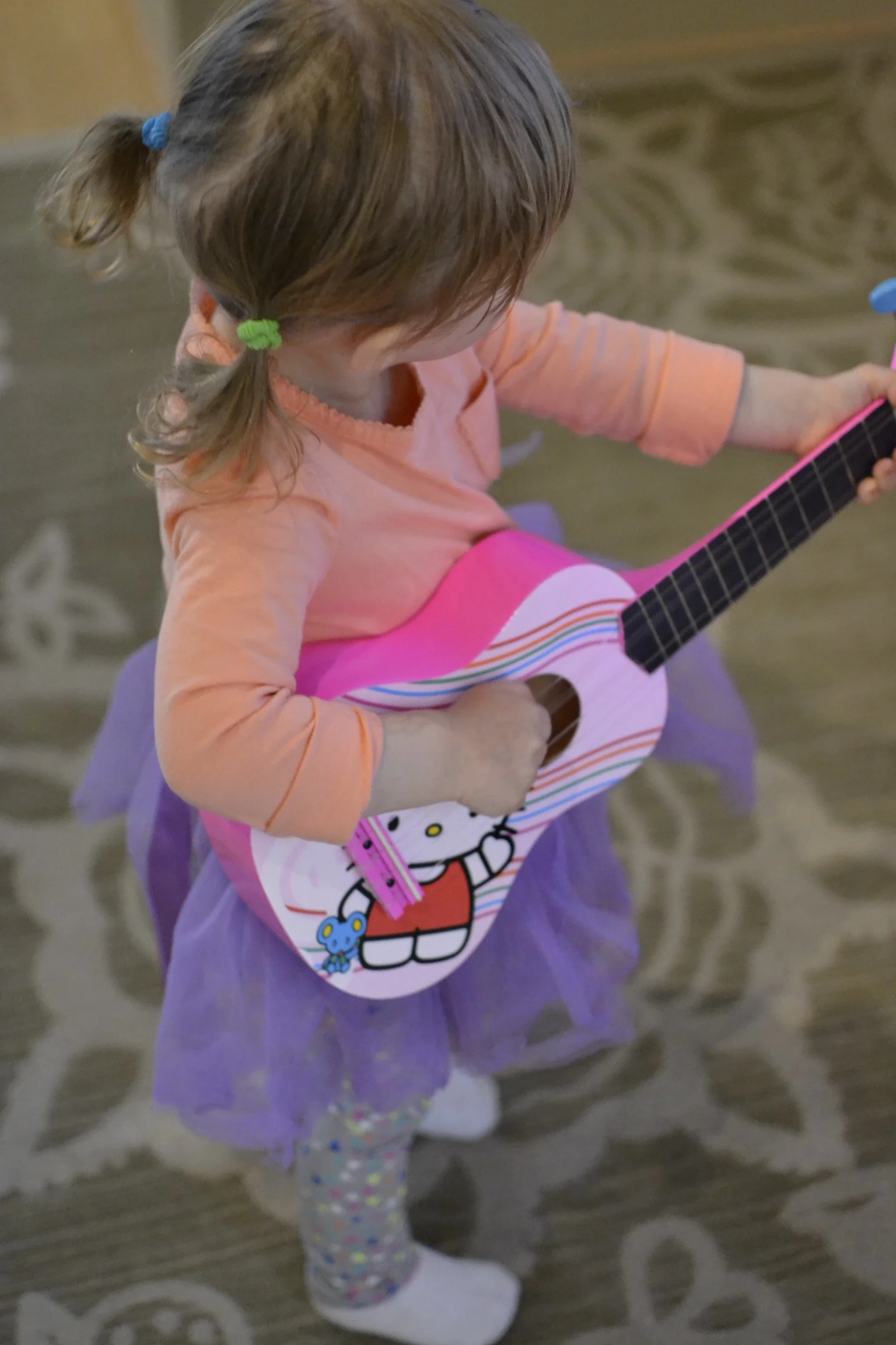 purple tutu wearing and guitar playing...
