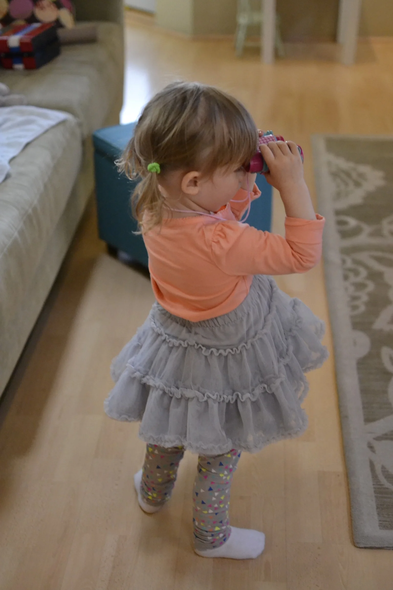 and then, 2 minutes later....deciding the grey tutu was much better. 