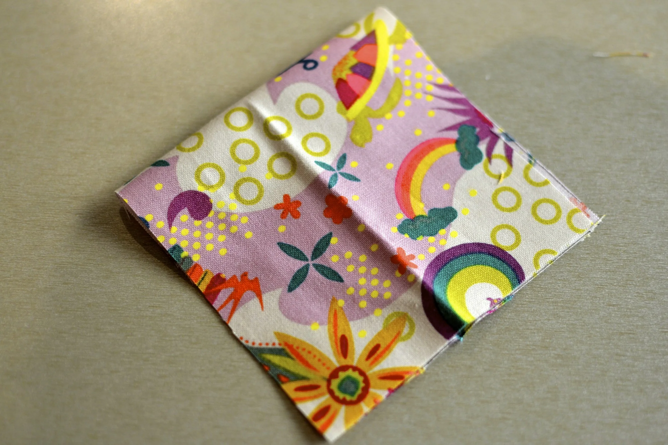 fold each rectangle in half, creating a 4" square