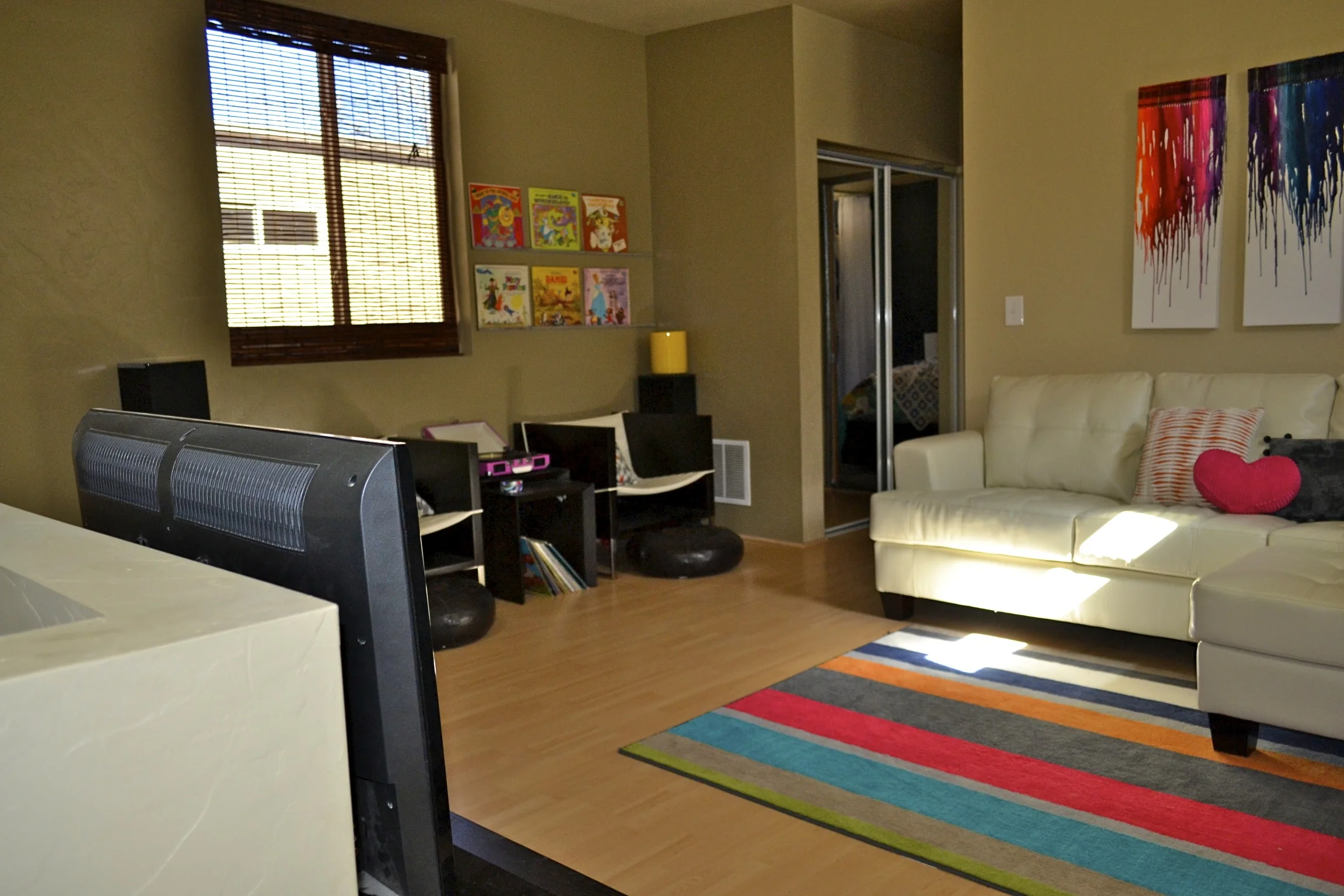 Third level family room. The mirrored closet doors to the back of this photo house the mechanical closet. 