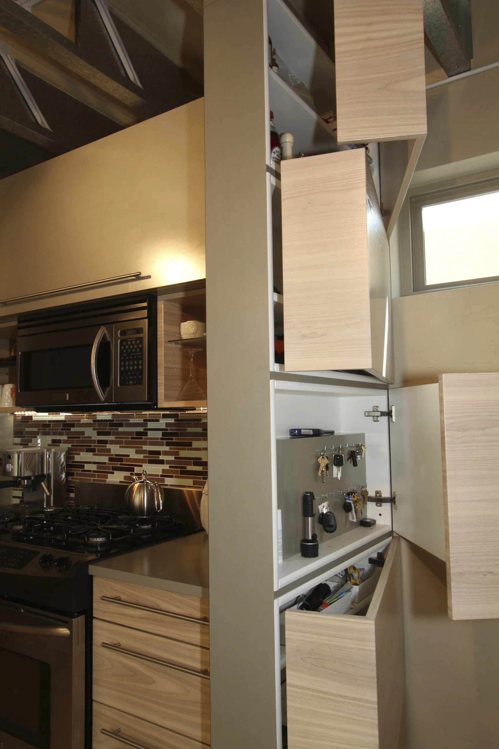Hidden wall storage cabinets - doors open