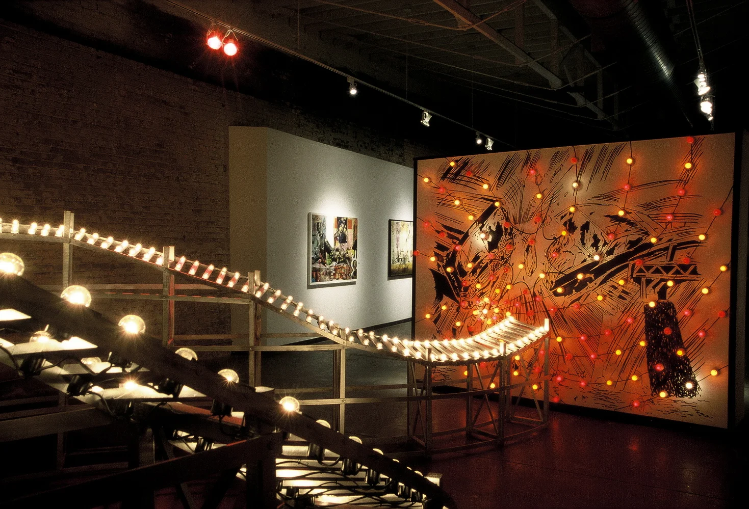   Malfunction Junction , 2004,&nbsp; wood structure with chasing lights, wall drawing with spiral of erratically blinking lights and soundtrack (electrical drones and clicks, re-verbed music box and rock/punk/car songs) ,&nbsp; wood structure 8.5 x&n