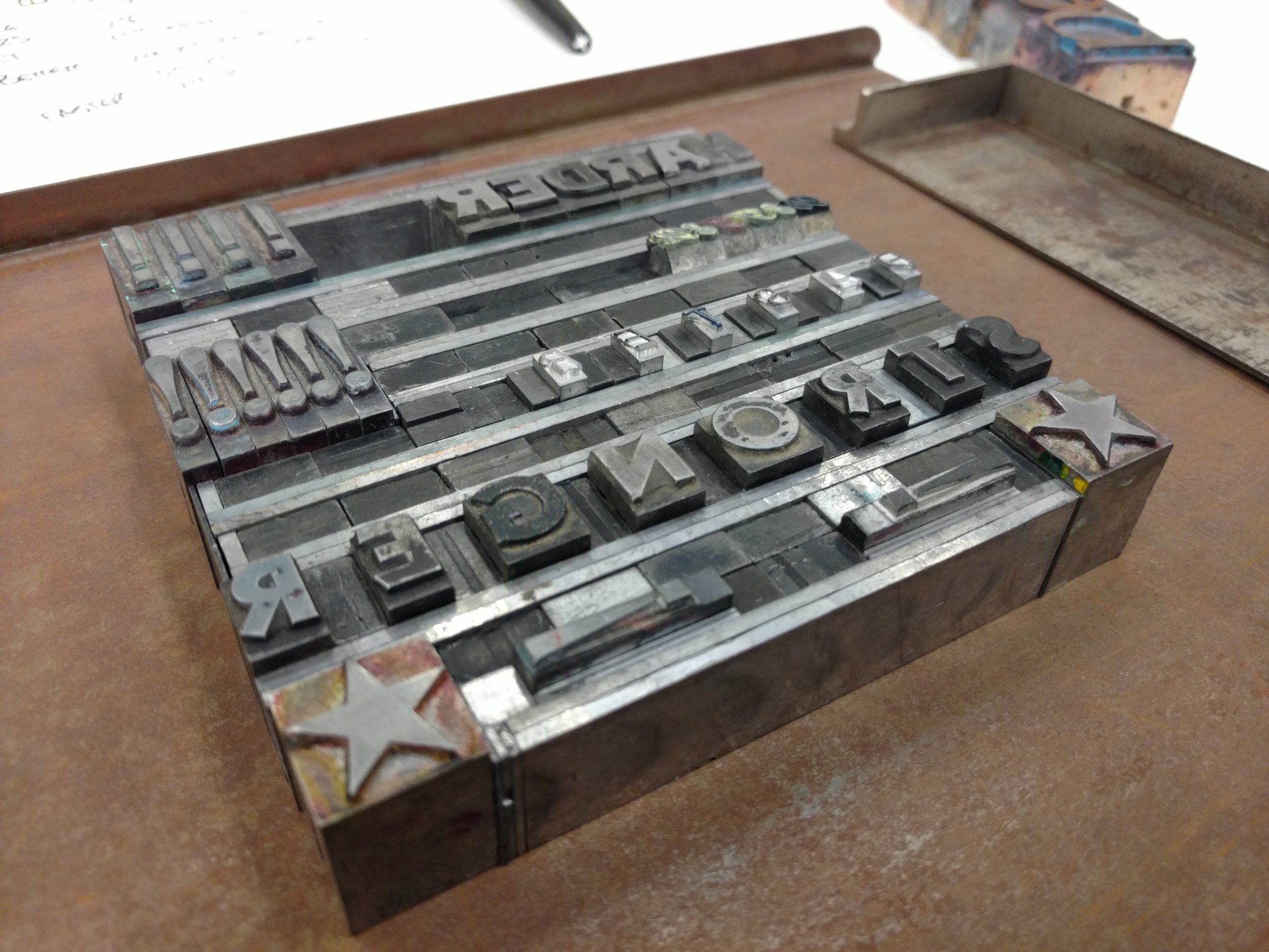 Letterpress Typesetting - STRONGER An image of the assembled typeset. Very delicate and tricky to move due to the precision and complexity of the arrangement.