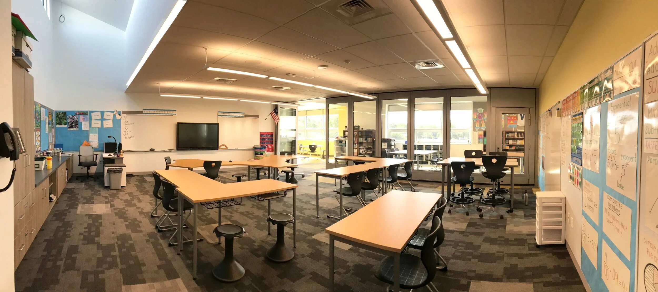 Classroom Interior The classrooms receive ample amounts of natural light from the Project Spaces. Additionally, the upper level classrooms use large clerestories to bring in indirect light. Motorized roller shades on the clerestory windows provide t…
