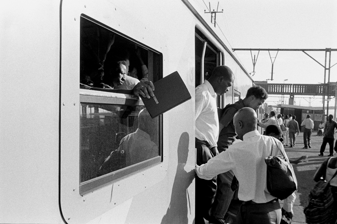 Rene Paul Savignan, Welcoming members to the train-church car 2002.jpg
