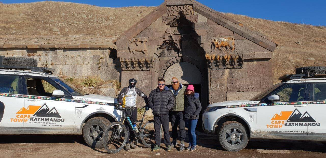 The team at an ancient, stone-built Caravanserai – a place where Silk Route traders of old used to stay with their camels and donkeys in the harsh highlands of Armenia.jpg