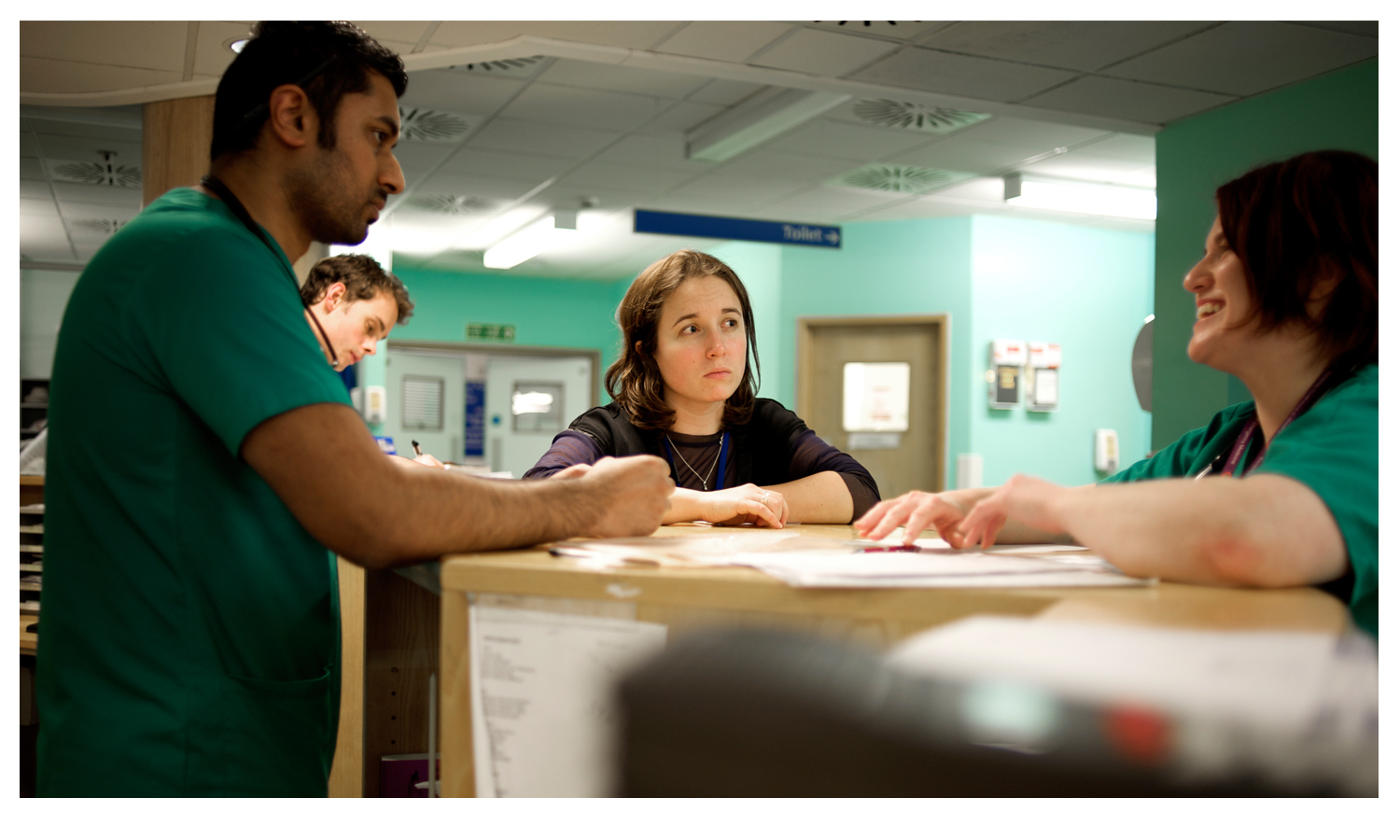  Staff discussing potential issues whilst at work.&nbsp;© Andy Smith 2014 