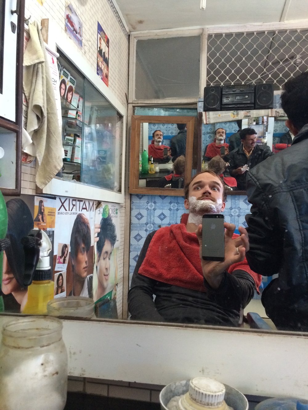  Slightly spooked while getting a shave with the locals in northern India. Shot on iPhone 5S.&nbsp; 