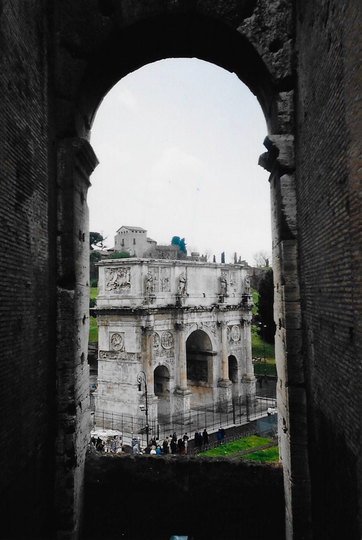 The Arch of Septimius Severus at the edge of the Roman Forum as seen from the interior of the Colosseum in Rome