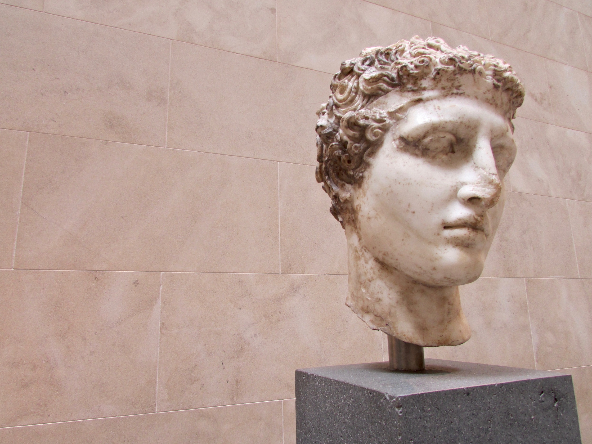 Marble head of an athlete in the Greek and Roman Art wing of The MET, NYC
