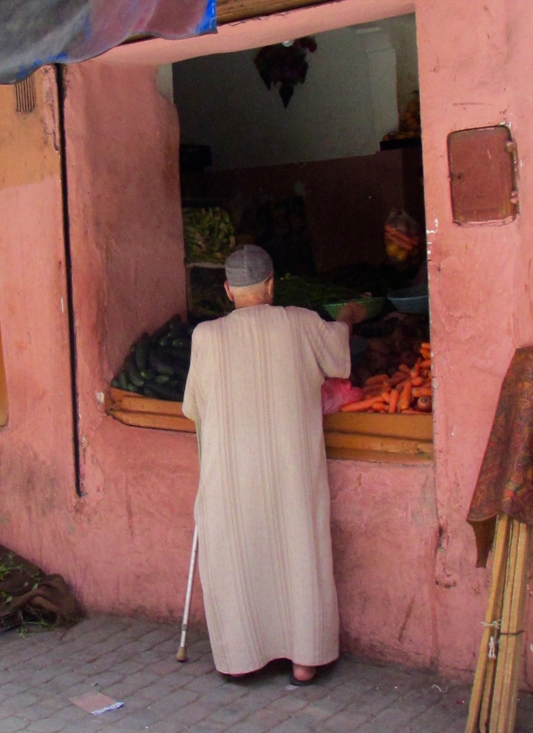 A man buying vegetables for a traditional Ramadan soup that is eaten when the sun sets in Marrakesh, Morocco