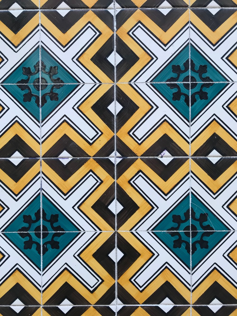 Why are the buildings in Portugal covered in tile?