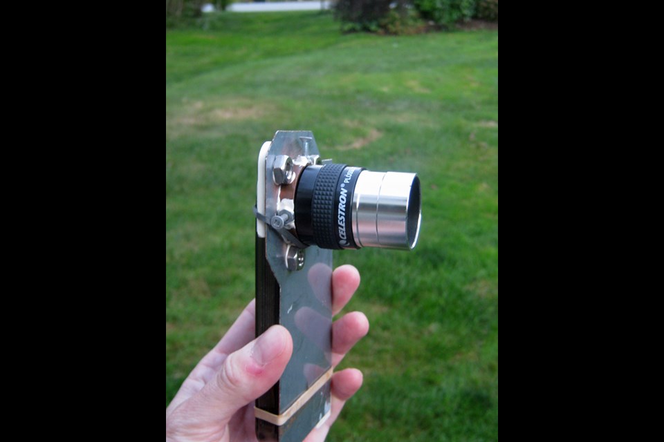   Art Cole designed a bracket that attaches his iPhone to his telescope, which keeps the phone camera steady taking video of the planets and the moon. (ART COLE)  