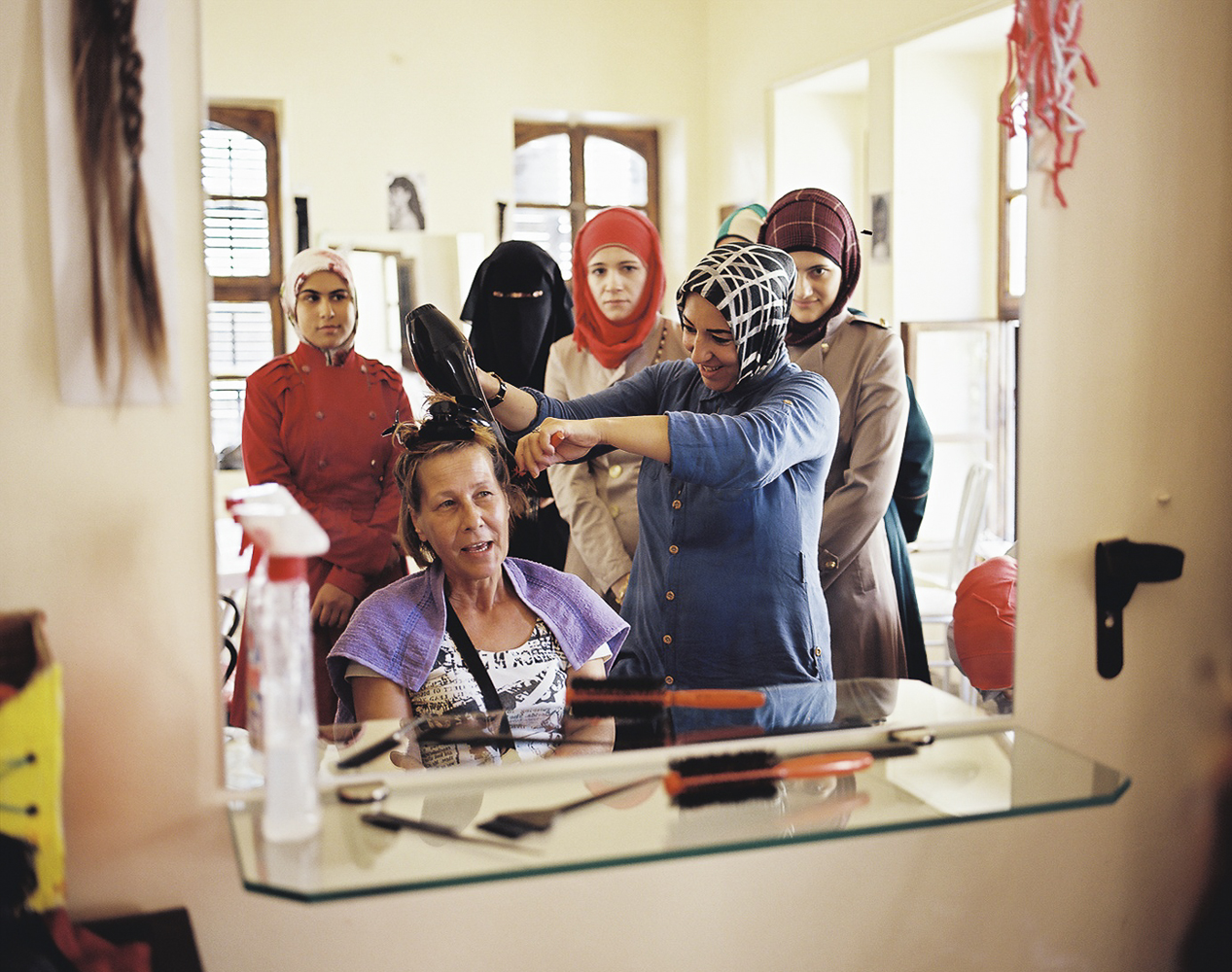 Syrian women refugees at a beauty school in a center offering job training for displaced Syrians looking for work in Kilis, Turkey. 