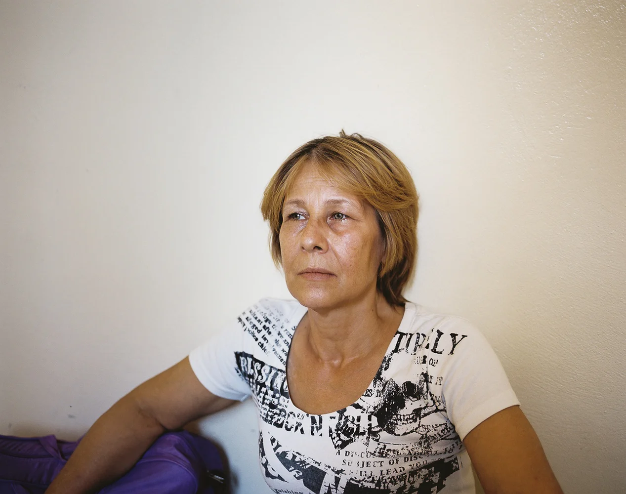 Iman took advantage of her foreign appearance to smuggle supplies for civilians in need during the revolution. On April 13, 2014, Iman smuggled herself and two girlfriends into Turkey, looking for work and surviving off of $30USD monthly UN food vouchers. A social worker (also a Syrian refugee) found Iman and offered her a place to stay at her barely furnished apartment in Kilis. Here, she settles into an empty room with her backpack and few possessions.