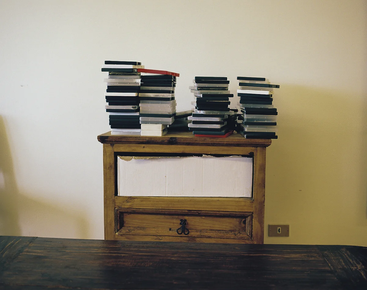 Detail of DVDs with missing TV and DVD player from a recreation room in Akranes. About forty to fifty men from dozens of different countries seeking asylum are housed in an isolated rural area distant and difficult to reach from Reykjavik.