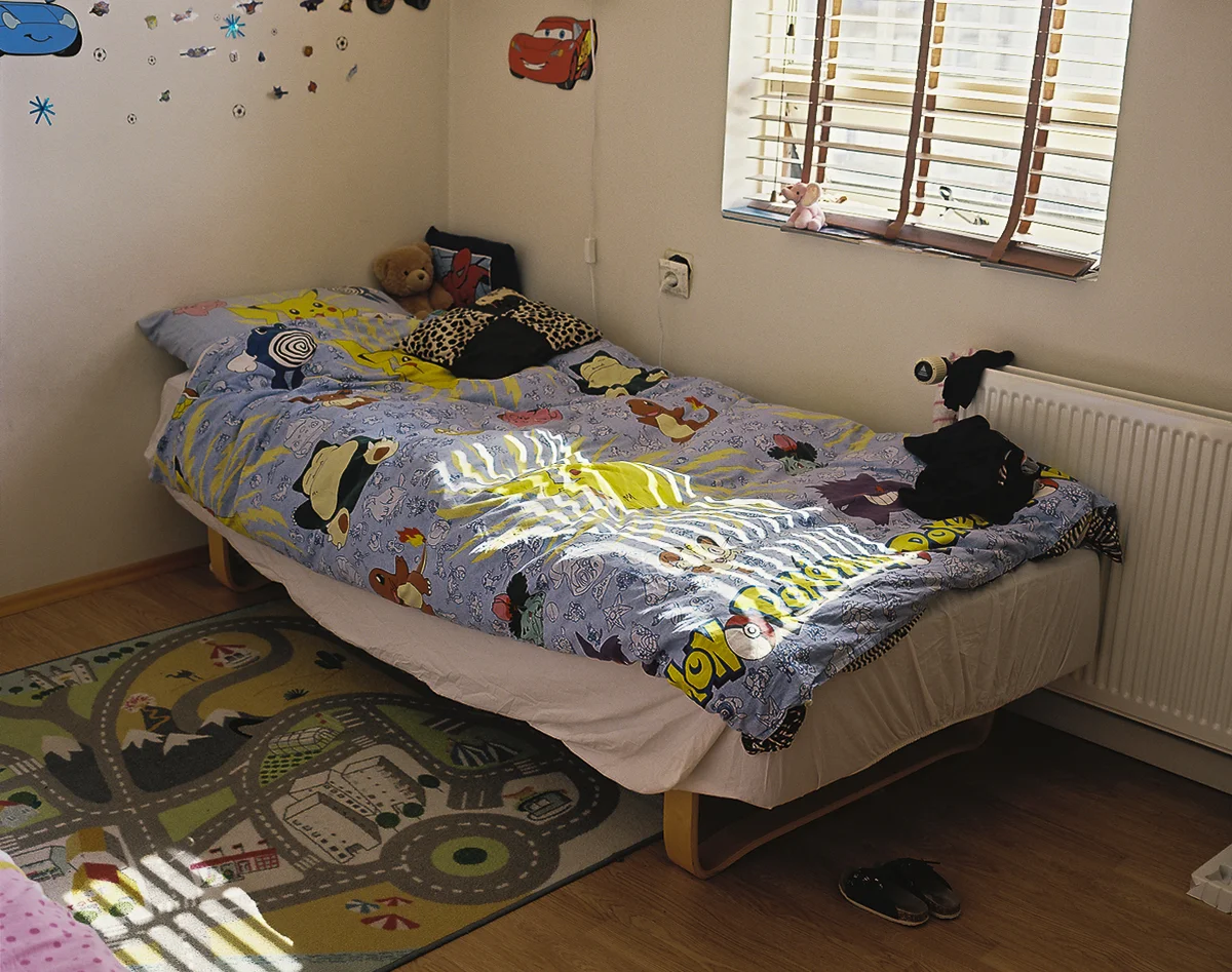 Bedroom of Hassan and Sinam's twelve-year-old son who is enrolled in school and has made friends since the family's arrival in Iceland nearly three years ago.