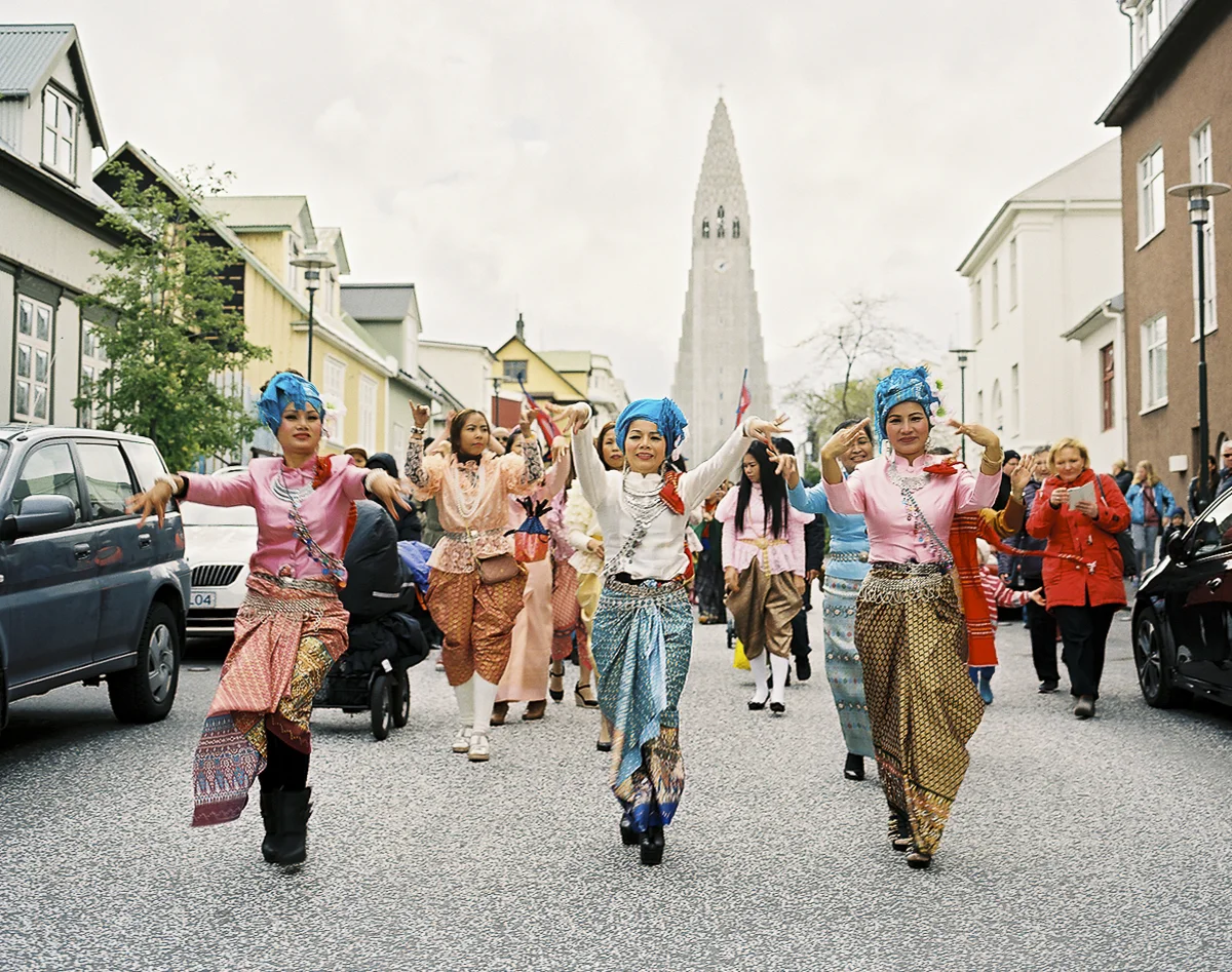 Immigrant residents representing their country of origin participate in a parade on the eighth annual "Multicultural Day" festival and celebration in Reykjavik on May 28, 2016.