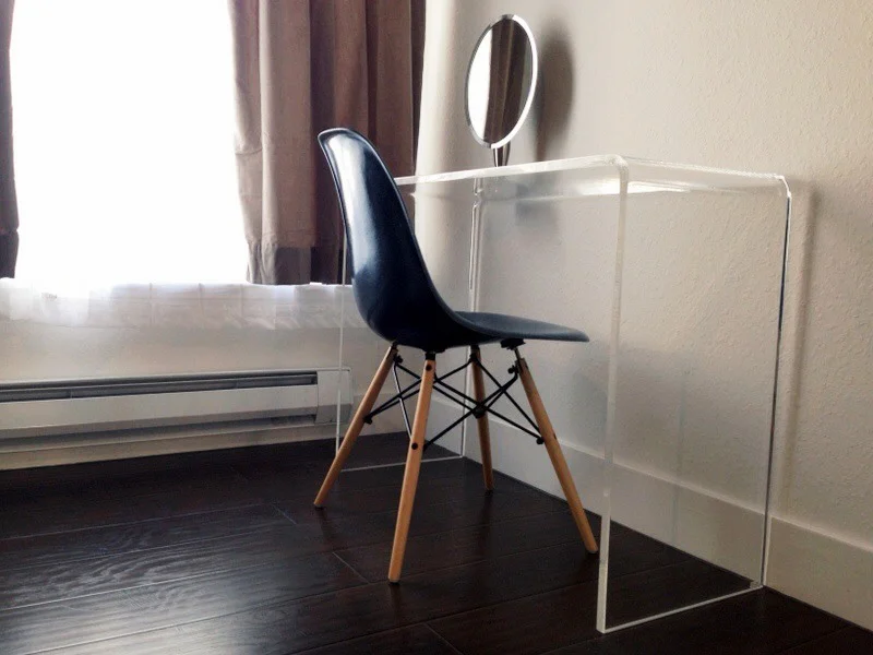 HERMAN MILLER vintage Eames chair (from Etsy) / POTTERY BARN velvet drapes (stone) / CB2 Peekaboo clear console table