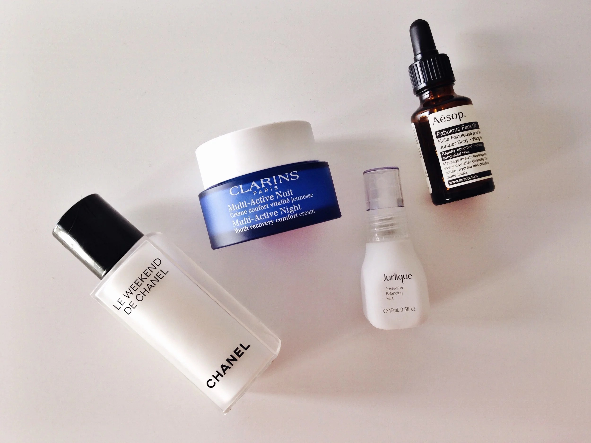 CHANEL Le Weekend / CLARINS multi-active night cream / JURLIQUE rose water mist / AESOP face oil