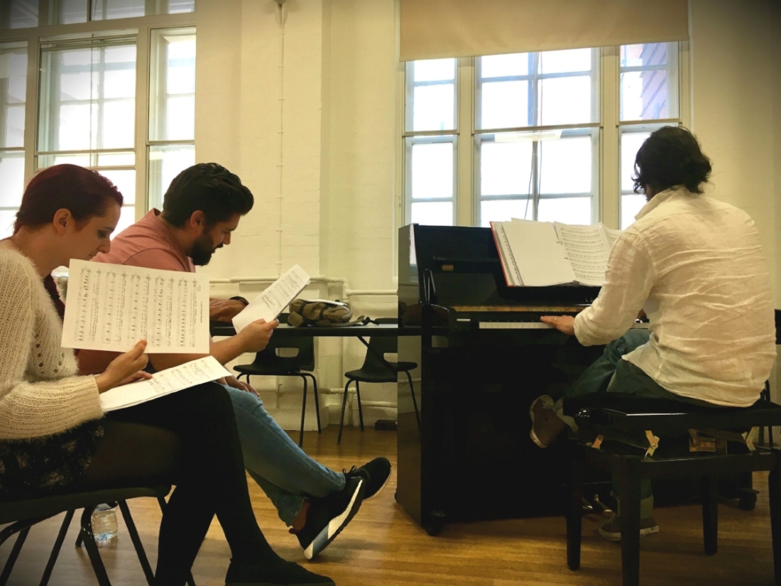 Alex the composer and two of our actors, Suzanna and Joseph, working on the songs