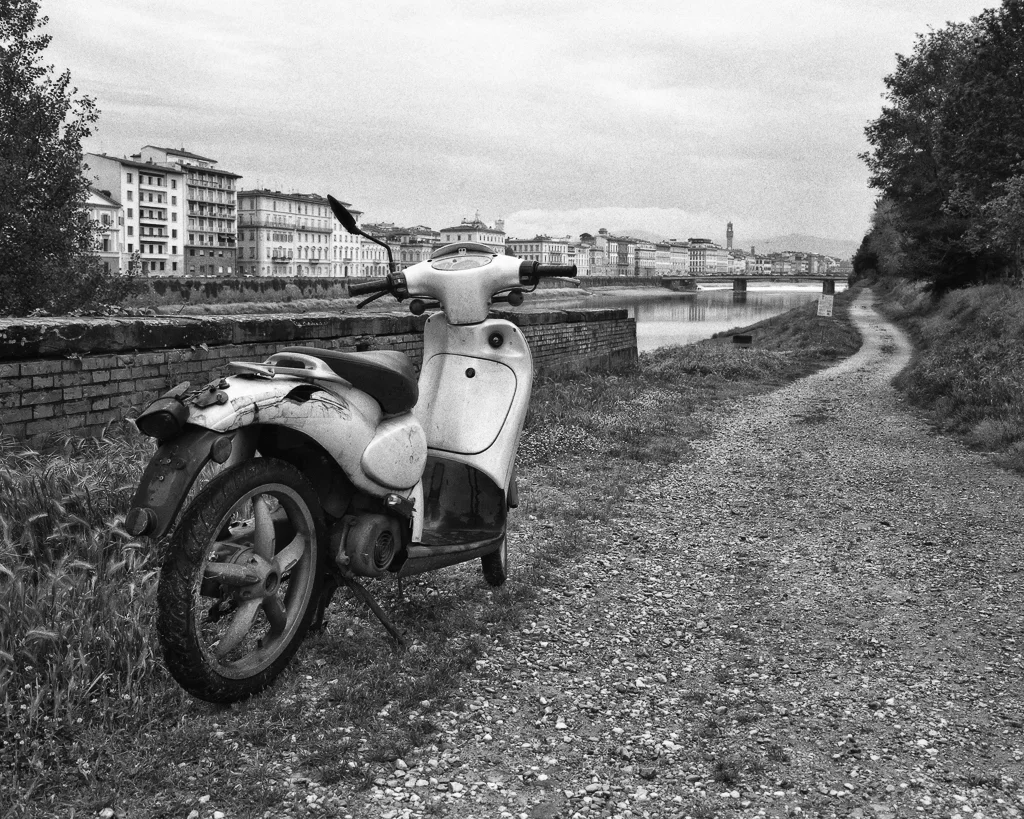 Firenze. Vespa with the Arno and Florence in background