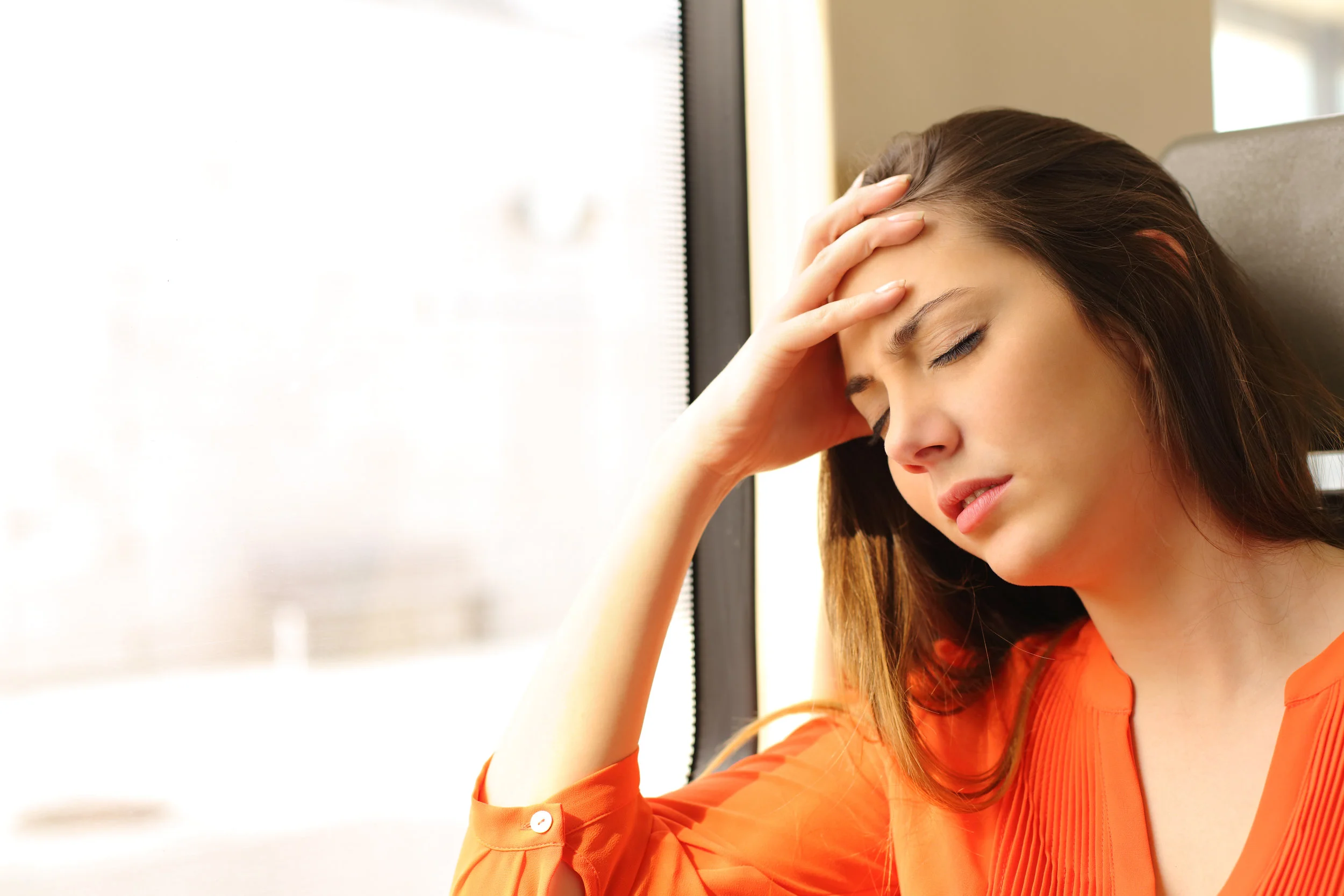 Fatigue-Woman feeling dizzy in a train travel.jpg