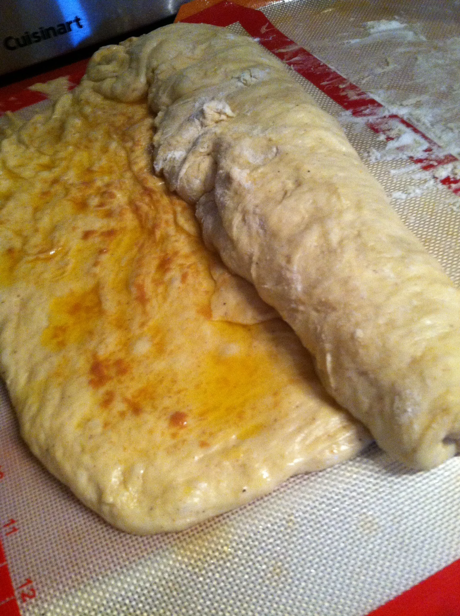The dough after the first rise, with the citrus filling. 