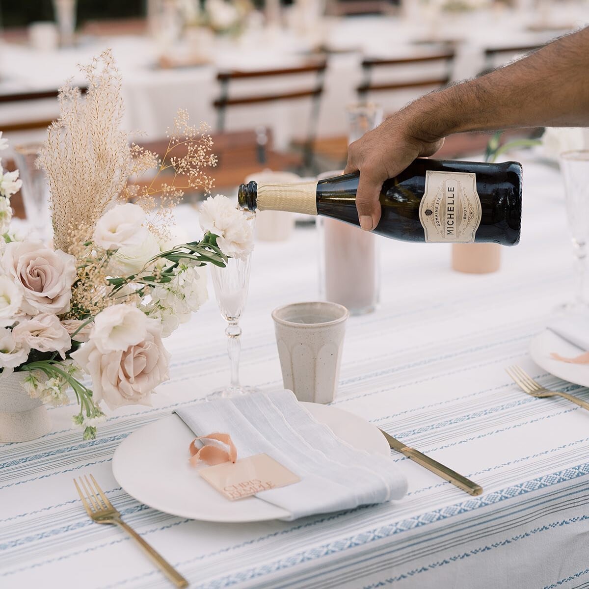 Champagne is always a good idea 🍾 Planning and Design: @fawnevents @fawnevents.erica | Venue: @grandgimeno | Photography: @mallorydawnphoto | Florals: @cultivatedbyfaith | Tabletop: @hostesshaven | Signage: @wildhouseink