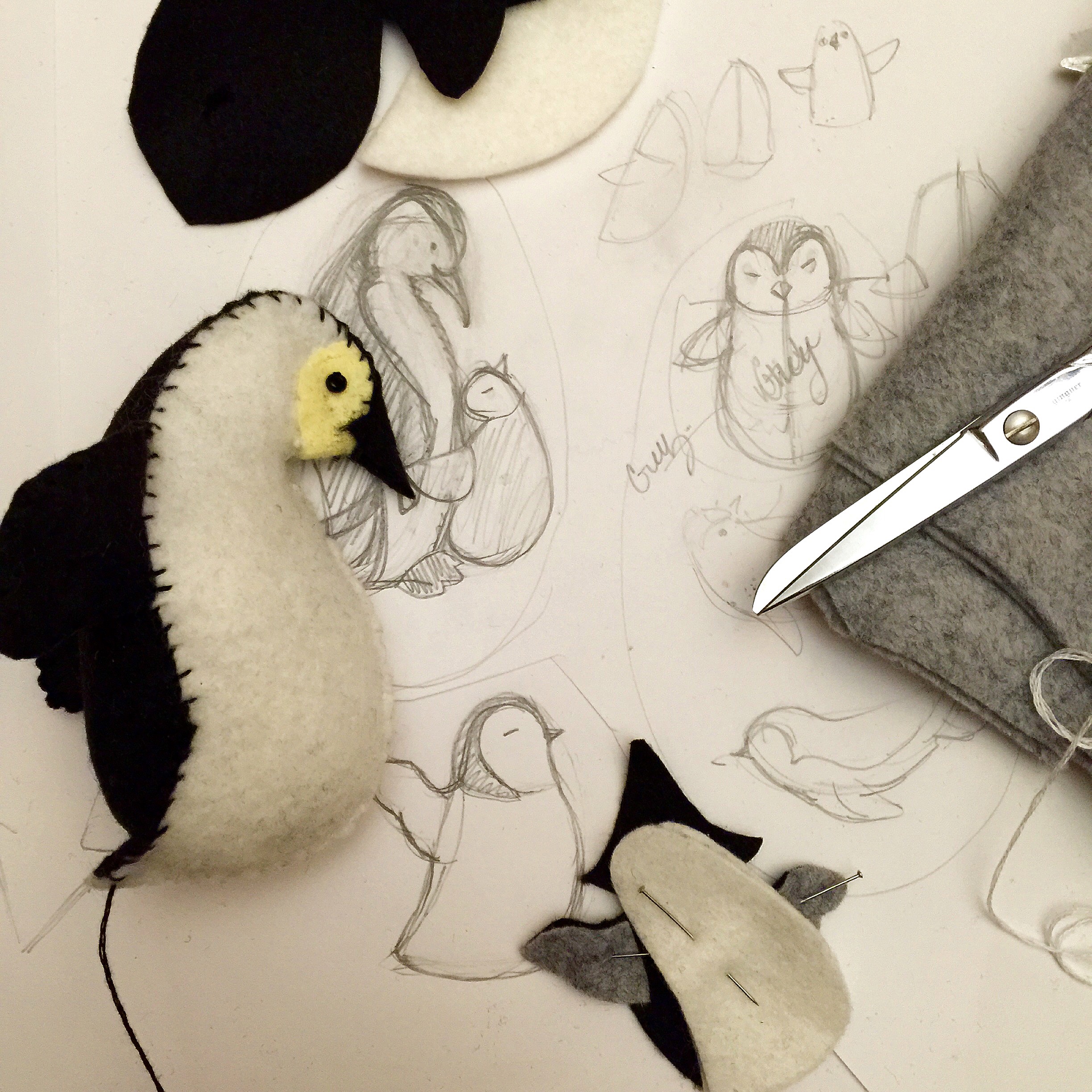 My work table is always a jumble of sketches, fabric scraps, scissors and pins.