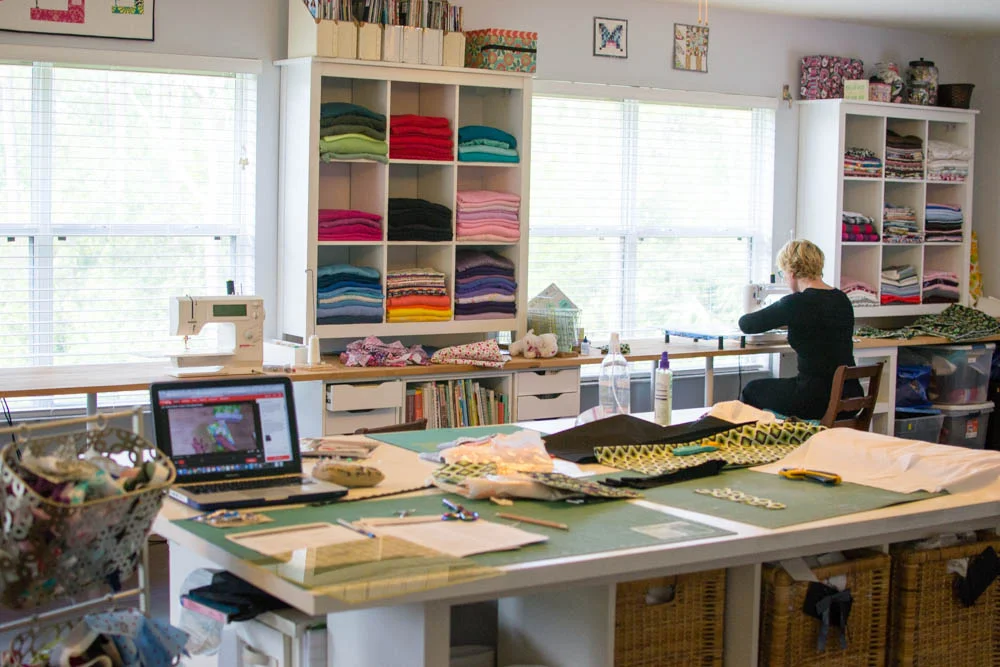 That's Heather over there sewing away on the Ultimate Travel Bag.