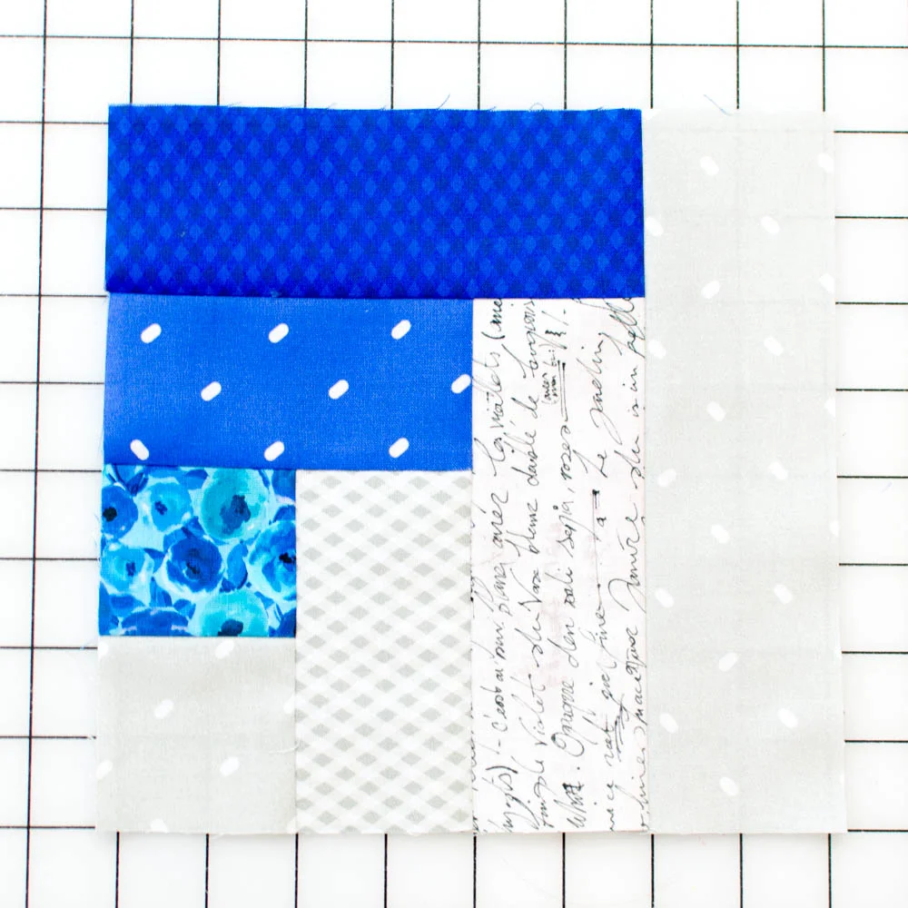 Quilt block unit with the last piece - another fabric 1 added.